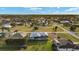 Expansive aerial shot of a home with modern roof and screened in lanai at 7363 N Moss Rose, Punta Gorda, FL 33955