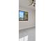 Bright bedroom with a ceiling fan and large window with black trim that allows for natural light at 7363 N Moss Rose, Punta Gorda, FL 33955