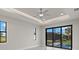 Bright bedroom with large windows and sliding glass doors that allow for natural light at 7363 N Moss Rose, Punta Gorda, FL 33955