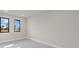 Light-filled bedroom showcasing clean lines, modern windows and elegant tile flooring at 7363 N Moss Rose, Punta Gorda, FL 33955