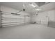 Spacious garage with epoxy flooring, two garage doors, and ample room for parking and storage at 7363 N Moss Rose, Punta Gorda, FL 33955