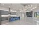 Open-concept living space with elegant lighting, a fireplace, and views of the outdoor area at 7363 N Moss Rose, Punta Gorda, FL 33955