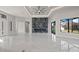 Open concept living area with a large marble wall and a fireplace at 7363 N Moss Rose, Punta Gorda, FL 33955