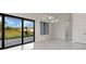 Spacious room with glass doors providing access to outdoor landscape and decorative lighting at 7363 N Moss Rose, Punta Gorda, FL 33955