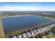 Expansive aerial view of lakeside homes highlighting serene water views and community layout at 8604 Shore Lake Dr, Englewood, FL 34224