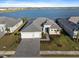 Aerial view of a single-Gathering home close to a tranquil lake at 8604 Shore Lake Dr, Englewood, FL 34224