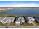 Aerial view of homes with lakefront access, showcasing the community and waterfront setting at 8604 Shore Lake Dr, Englewood, FL 34224
