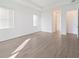Bedroom featuring tile floors, two windows, and recessed lighting at 8604 Shore Lake Dr, Englewood, FL 34224