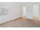 Bright bedroom featuring wood-look tile flooring and a window with blinds at 8604 Shore Lake Dr, Englewood, FL 34224