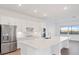 Modern kitchen with an island and stainless steel appliances at 8604 Shore Lake Dr, Englewood, FL 34224