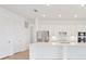 Bright kitchen featuring white cabinets, stainless steel appliances, and a large center island at 8604 Shore Lake Dr, Englewood, FL 34224
