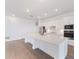 Modern kitchen features a large island with stainless steel appliances and ample counter space at 8604 Shore Lake Dr, Englewood, FL 34224