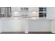 Close-up of the kitchen island highlighting the white countertop and cabinets at 8604 Shore Lake Dr, Englewood, FL 34224