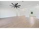 Bright and open living room offers ample space, tile floors, and neutral color palette at 8604 Shore Lake Dr, Englewood, FL 34224