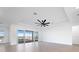 Bright living room featuring tile floors and sliding glass doors leading to outdoor space at 8604 Shore Lake Dr, Englewood, FL 34224