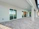 A spacious patio provides access to the home's interior through multiple glass doors at 8604 Shore Lake Dr, Englewood, FL 34224