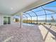 An expansive screened patio overlooks the tranquil lake, ideal for outdoor living and entertaining at 8604 Shore Lake Dr, Englewood, FL 34224