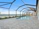 A beautiful screened-in pool offers stunning waterfront views and a relaxing atmosphere at 8604 Shore Lake Dr, Englewood, FL 34224