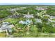 Aerial view of a community pool with palm trees and playground at 12492 Shimmering Oak Cir, Venice, FL 34293