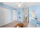 Inviting bedroom featuring coastal decor, closet, and calming light blue walls at 12492 Shimmering Oak Cir, Venice, FL 34293