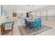 Dining area with seating for six, seamlessly connected to the kitchen and living room at 12492 Shimmering Oak Cir, Venice, FL 34293