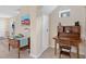 View of hallway with classic furniture, coastal decor, and neutral paint tones at 12492 Shimmering Oak Cir, Venice, FL 34293