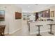 Modern kitchen featuring granite countertops, stainless steel appliances, and a breakfast bar at 12492 Shimmering Oak Cir, Venice, FL 34293
