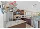 Stylish kitchen with granite countertops, stainless steel appliances, and a convenient center island at 12492 Shimmering Oak Cir, Venice, FL 34293