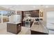 Well-equipped kitchen with stainless steel appliances, granite countertops, and center island at 12492 Shimmering Oak Cir, Venice, FL 34293