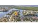 Stunning aerial view of waterfront homes with boat docks along a canal in a desirable neighborhood at 1303 Casey Key Dr, Punta Gorda, FL 33950