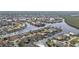 A scenic aerial view of a waterfront community features beautiful homes with private docks and easy canal access at 1303 Casey Key Dr, Punta Gorda, FL 33950