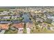 Overhead view displays luxurious homes along a waterway with tile roofs and tropical foliage at 1303 Casey Key Dr, Punta Gorda, FL 33950