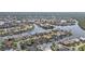 Aerial view displays waterfront homes with backyard docks, swimming pools, and access to winding canals at 1303 Casey Key Dr, Punta Gorda, FL 33950