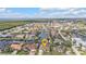 Aerial view of a waterfront home and its neighborhood in a coastal community at 1303 Casey Key Dr, Punta Gorda, FL 33950