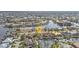 Beautiful aerial view of canal-front homes with private docks and lush landscaping in a coastal community at 1303 Casey Key Dr, Punta Gorda, FL 33950