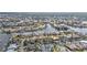 An aerial view shows homes on canals with easy water access, boat docks, and neighborhood amenities at 1303 Casey Key Dr, Punta Gorda, FL 33950