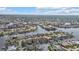 Aerial shot features a waterfront community showcasing homes with private docks and canal access at 1303 Casey Key Dr, Punta Gorda, FL 33950