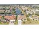 A scenic aerial view features waterfront homes with private boat docks and lush landscaping at 1303 Casey Key Dr, Punta Gorda, FL 33950