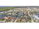 Birds-eye shot features a canal-lined community filled with beautiful tile-roofed homes at 1303 Casey Key Dr, Punta Gorda, FL 33950