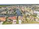 An aerial shot showcasing waterfront properties with canal access and well-maintained lawns at 1303 Casey Key Dr, Punta Gorda, FL 33950