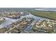 An aerial view of a waterfront community with canals and beautiful homes in a coastal setting at 1303 Casey Key Dr, Punta Gorda, FL 33950