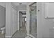 Bathroom featuring a marble shower and decorative floor, providing a blend of luxury and unique style at 1303 Casey Key Dr, Punta Gorda, FL 33950