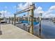 Close-up of a modern boat lift system on the waterfront, offering convenience for boating enthusiasts at 1303 Casey Key Dr, Punta Gorda, FL 33950