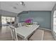 Dining area with a large table set, views of the pool, and hardwood flooring at 1303 Casey Key Dr, Punta Gorda, FL 33950