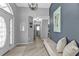 Inviting entryway with tiled floors, modern light fixture and neutral wall color at 1303 Casey Key Dr, Punta Gorda, FL 33950