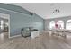 Cozy living area with modern furniture, wood floors, and dining space at 1303 Casey Key Dr, Punta Gorda, FL 33950