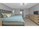 Spacious main bedroom with natural light, wood floors, and neutral decor at 1303 Casey Key Dr, Punta Gorda, FL 33950