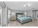 Main bedroom with wood floors, tray ceiling, and two windows with light-blocking shades at 1303 Casey Key Dr, Punta Gorda, FL 33950