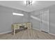 Bright office space with wood floors, neutral walls, a large desk, and a window at 1303 Casey Key Dr, Punta Gorda, FL 33950