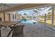 Patio view of refreshing pool and water views, enhancing the outdoor living space, offering relaxation at 1303 Casey Key Dr, Punta Gorda, FL 33950